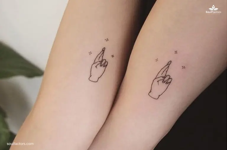 fingers-crossed small tattoo